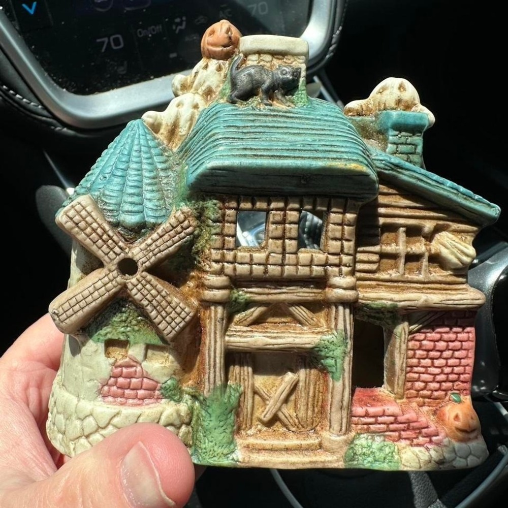 Whimsical ceramic house with pumpkin, bats, and windmill votive‎ holder